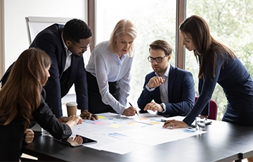 Group of business people around a table